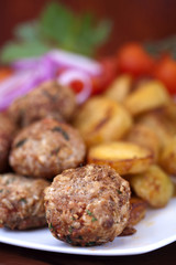 meatballs served with potatoes