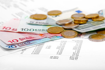 euro money coins and banknotes with payment bill