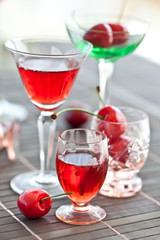 Various little glasses with cherry liquor