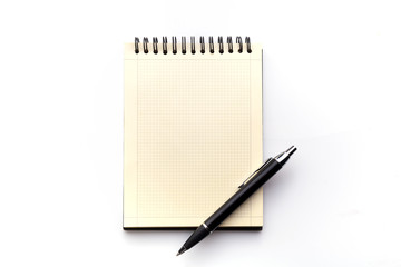 notebook and pen on a white background