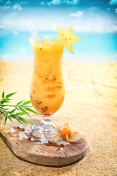 Delicious fruit cocktail on a tropical beach