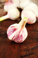 Fresh garlic, on wooden background