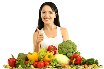 Girl with vegetables isolated on white