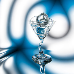 Mineral water or a cocktail with ice in glass