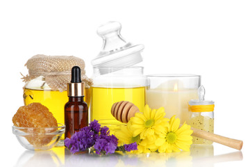 Fragrant honey spa with oils and honey isolated on white