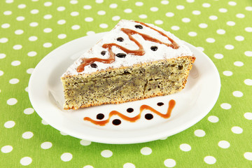 Delicious poppy seed cake on table close-up