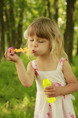 little girl with soap bubbles