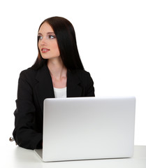 Young business woman working with computer, isolated on white