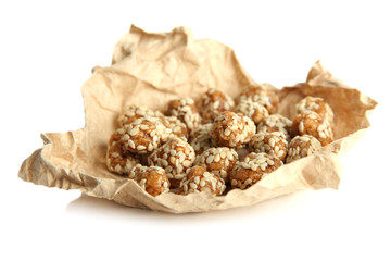 Tasty peanuts with sesame and caramel, isolated on white