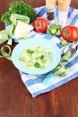 Cabbage soup in plates on napkin on wooden table