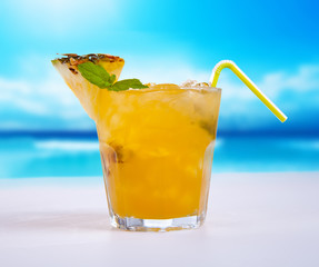 Summer drink with blur beach on background