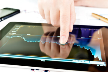 Hand touching screen of tablet pc