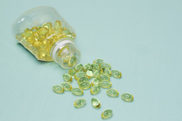 Fish oil capsule spread from bottle