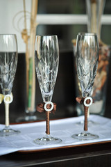 .Two wedding glasses of groom and bride on the table
