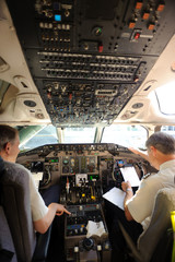 pilots preparing aircraft for take-off