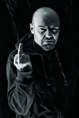 Rude man showing middle finger