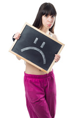 Sproty girl holding a chalkboard with sad message