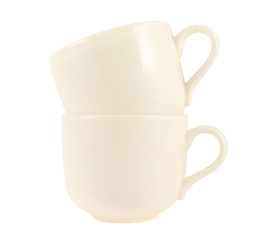 Ceramic cream colored cup pile isolated