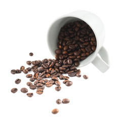 Spilled coffee beans from the cup isolated