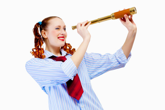 Young woman looking in telescope