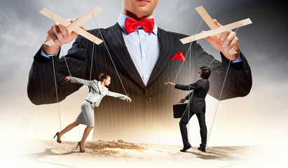 Businessman puppeteer