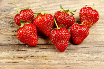 Fresh strawberries on wooden background