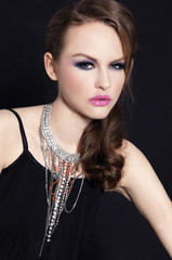 glamour girl with bright make-up-and Jewelry on black background