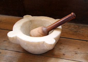 A Vintage Pestle and Mortar on a Wooden Table.