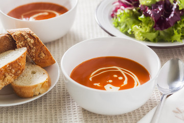 Tomato soup with side salad and crusty bread