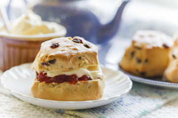 Traditional afternoon tea with scones, jam and cream