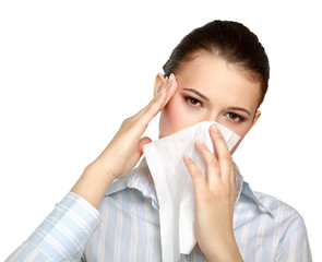 Sick woman blowing her nose, white background