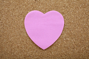 A Heart Sticky Label on a Notice Board