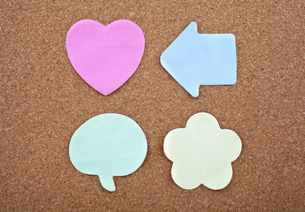 Four Different Sticky Notes on a Notice Board