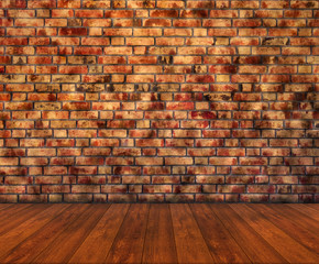 Wooden floor with brick wall