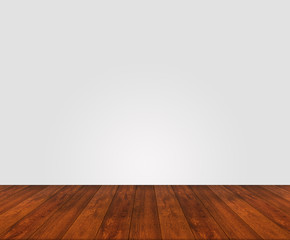 Wooden floor with white wall