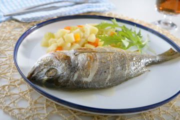 Baked sea bream with vegetables