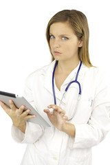 Beautiful female doctor working with tablet