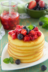 Pancakes with summer berries: strawberries, blueberries.