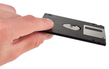 Floppy disk between fingers