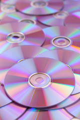 Many CD or DVD disks on each other