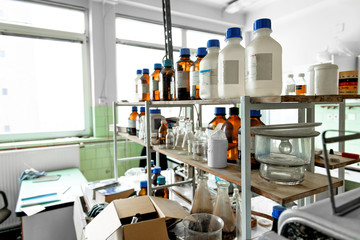 Photo of an old laboratory with a lot of bottles