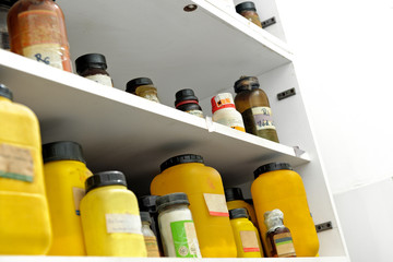 Photo of an old laboratory with a lot of bottles