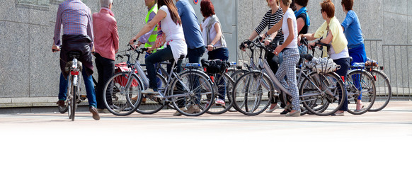 A large group of cyclists. Rent bikes.