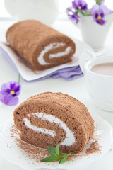 Chocolate roll with cream.