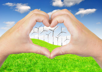 Fototapeta na wymiar wind turbine with heart from hands