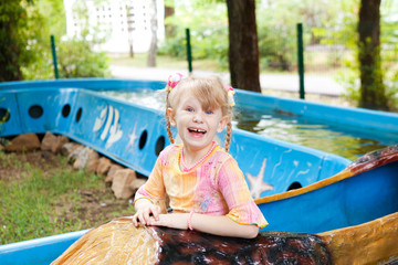 child in the boat in the park