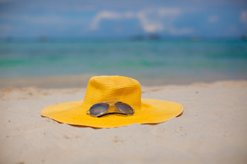 Fototapeta na wymiar Close-up hat and sunglasses on the beach in Boracay, Philippines