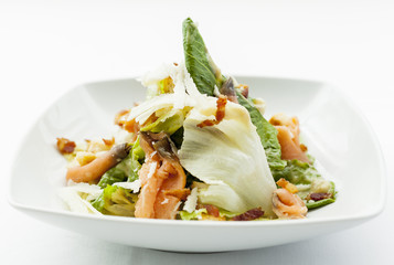 Caesar salad with chicken and mixed green.