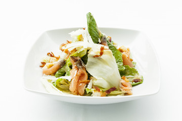 Caesar salad with chicken and mixed green.