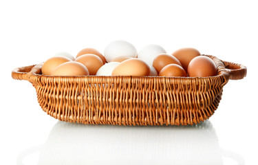 Many eggs in basket isolated on white